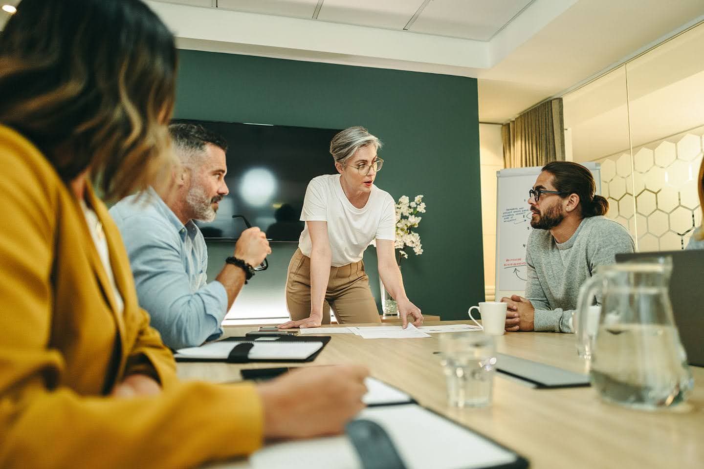A group of people discussing in a room